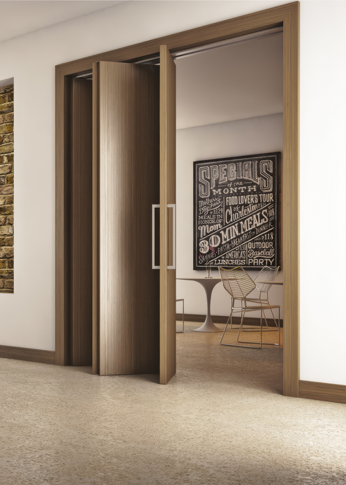 Modern interior with sliding wooden doors opening to a dining area.