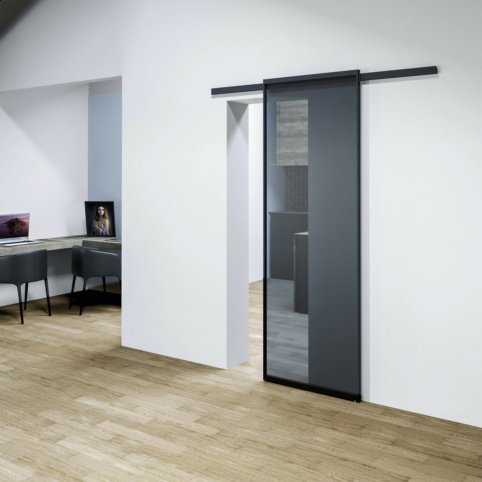 Modern sliding door in a minimalistic interior setting with wooden flooring and white walls.