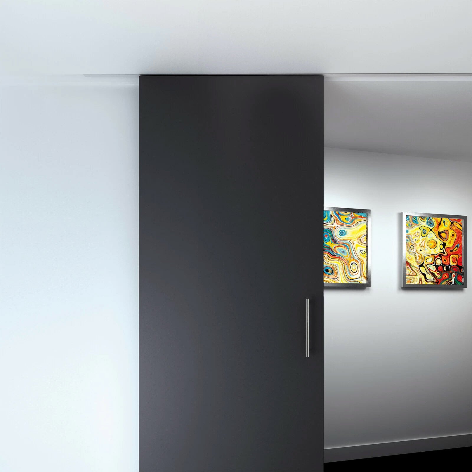 Modern kitchen with a black refrigerator and colorful abstract paintings on a white wall.