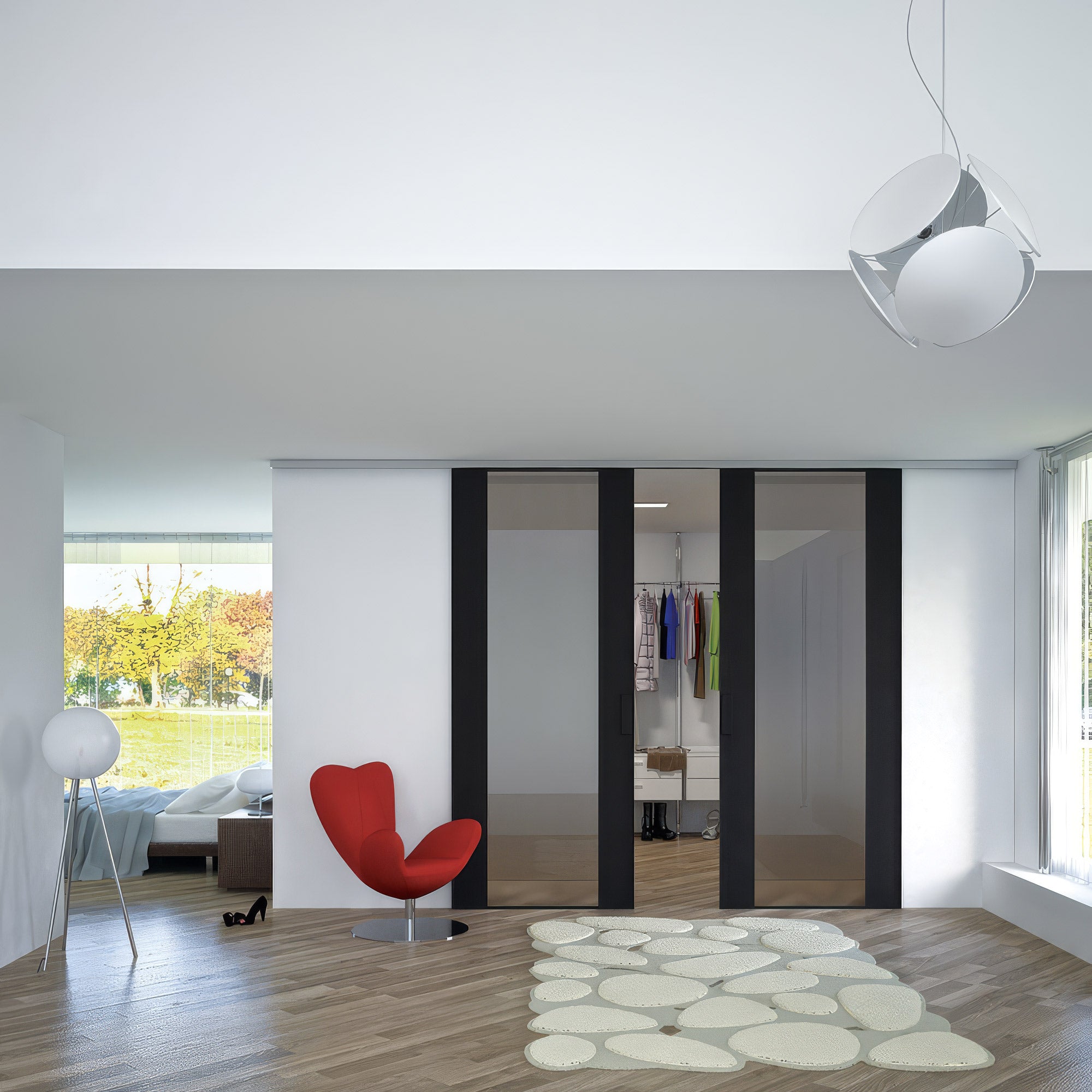 Modern interior with a red chair, white rug, and sliding glass doors.