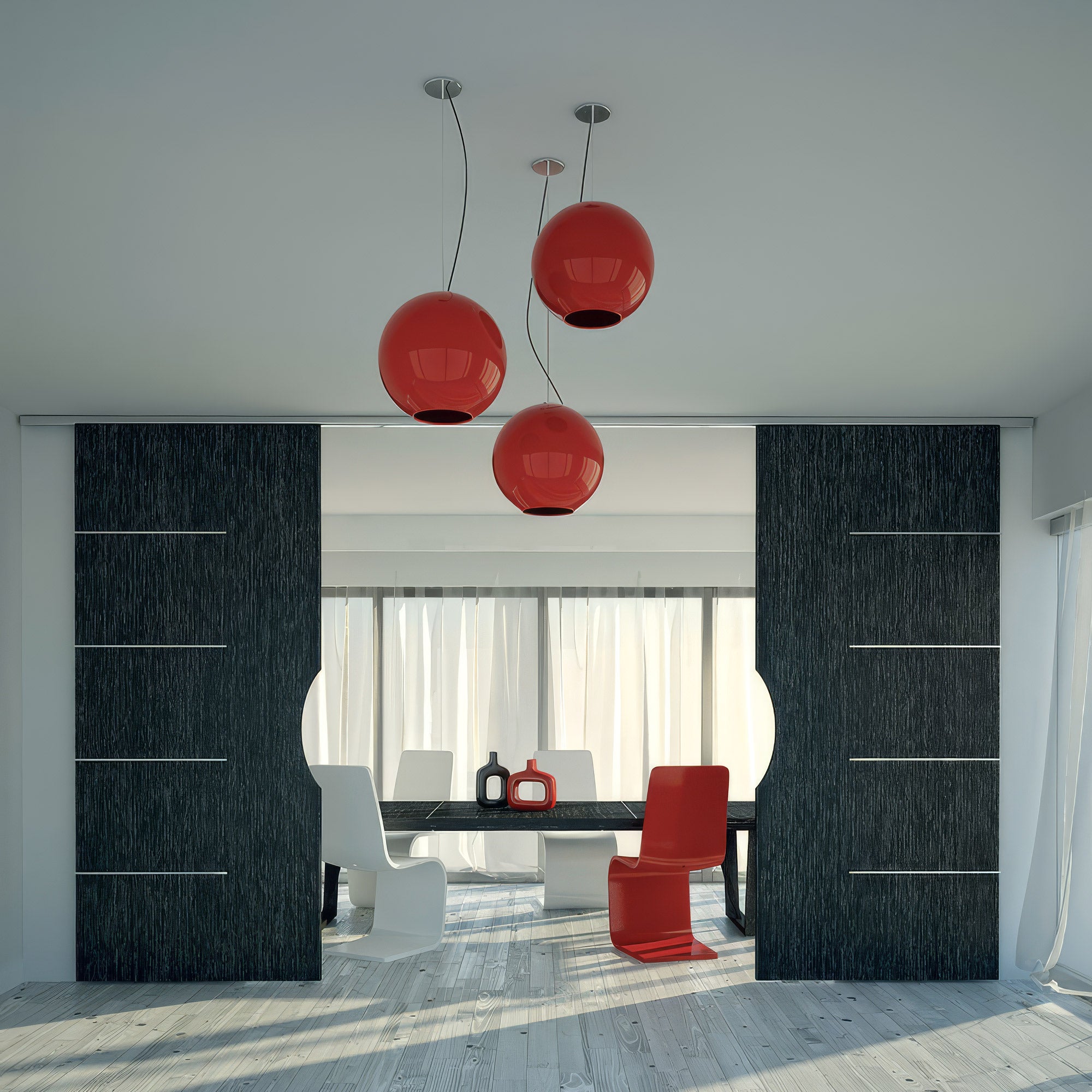Modern interior with red pendant lights, black and white furniture, and large windows.