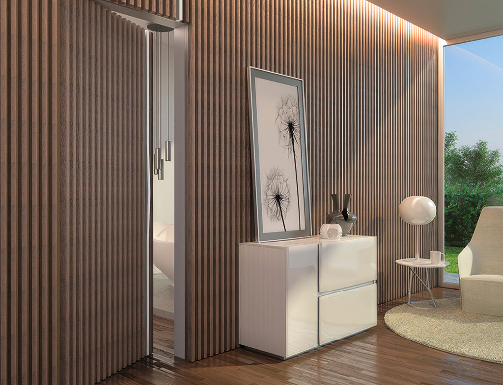 Modern interior design with a white cabinet, framed artwork, and a chair.
