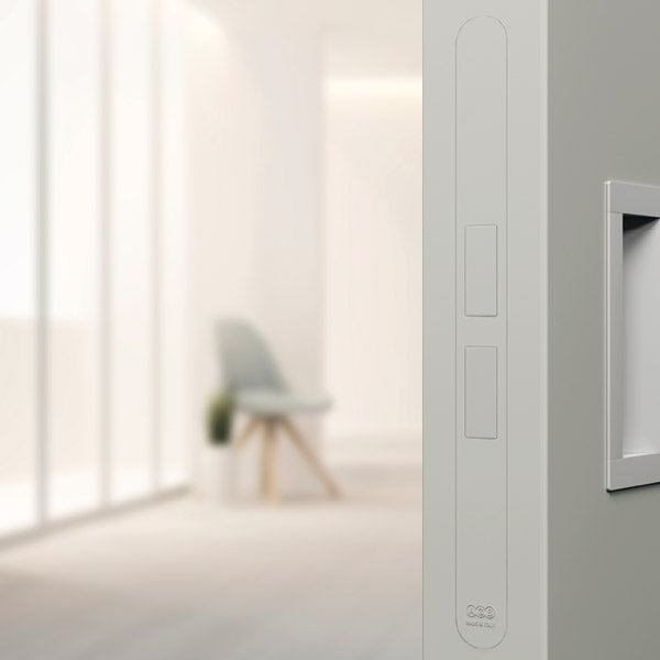 Modern interior with a light gray wall and a chair in the background