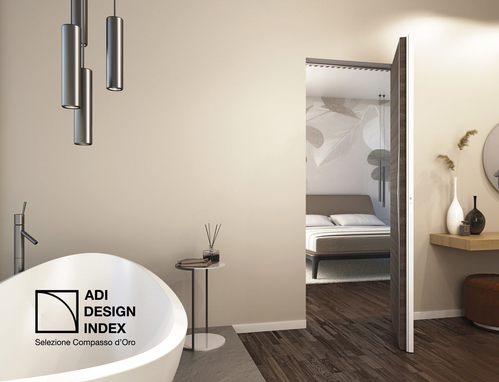 Modern bathroom with a bathtub and open closet revealing a bedroom featuring Design Index ADI selection