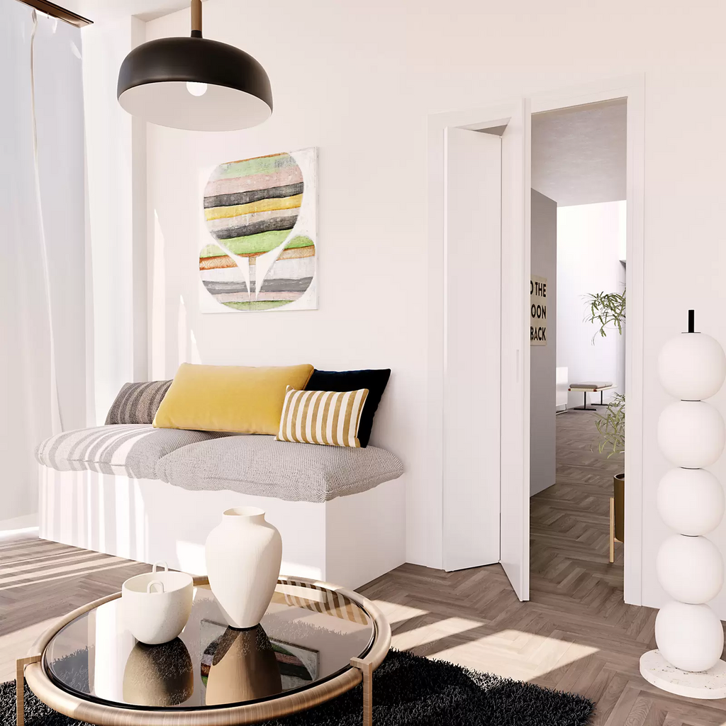 Modern living room with a gray sofa, yellow and striped cushions, and a coffee table.