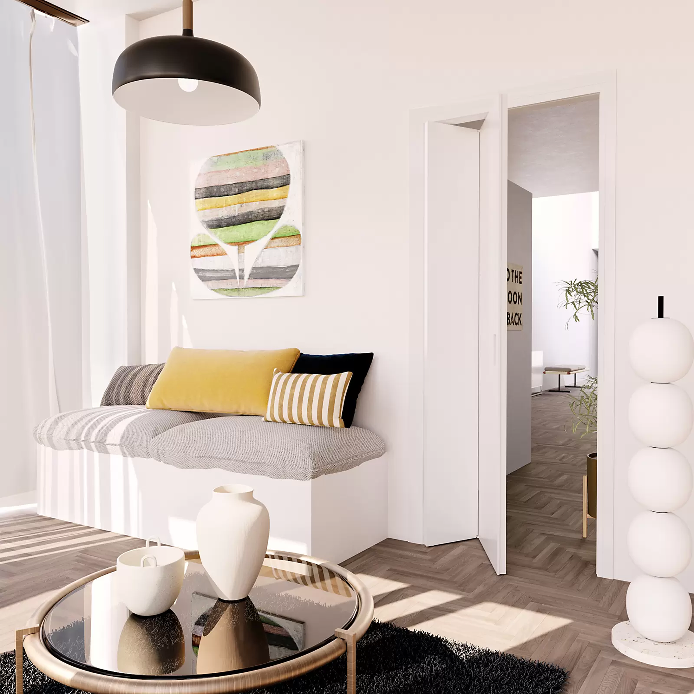 Modern living room with a gray sofa, yellow and striped cushions, and a coffee table.