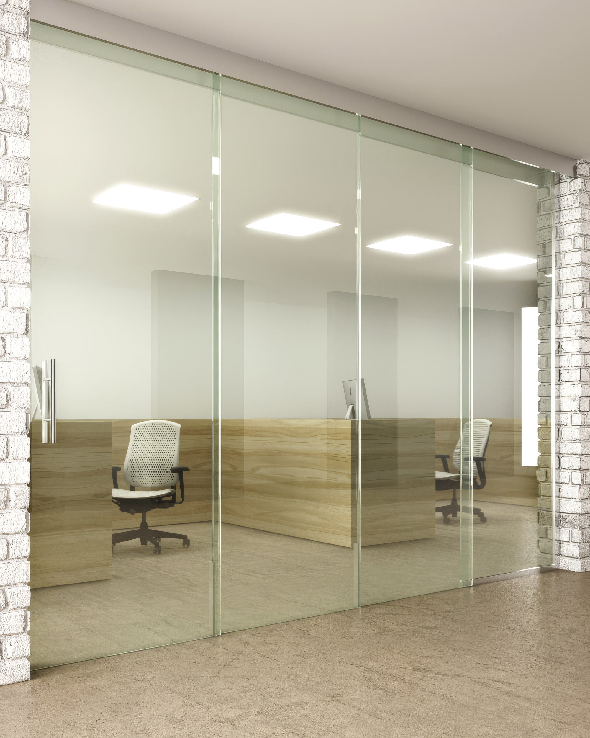 Modern office interior with glass walls and wooden desks.