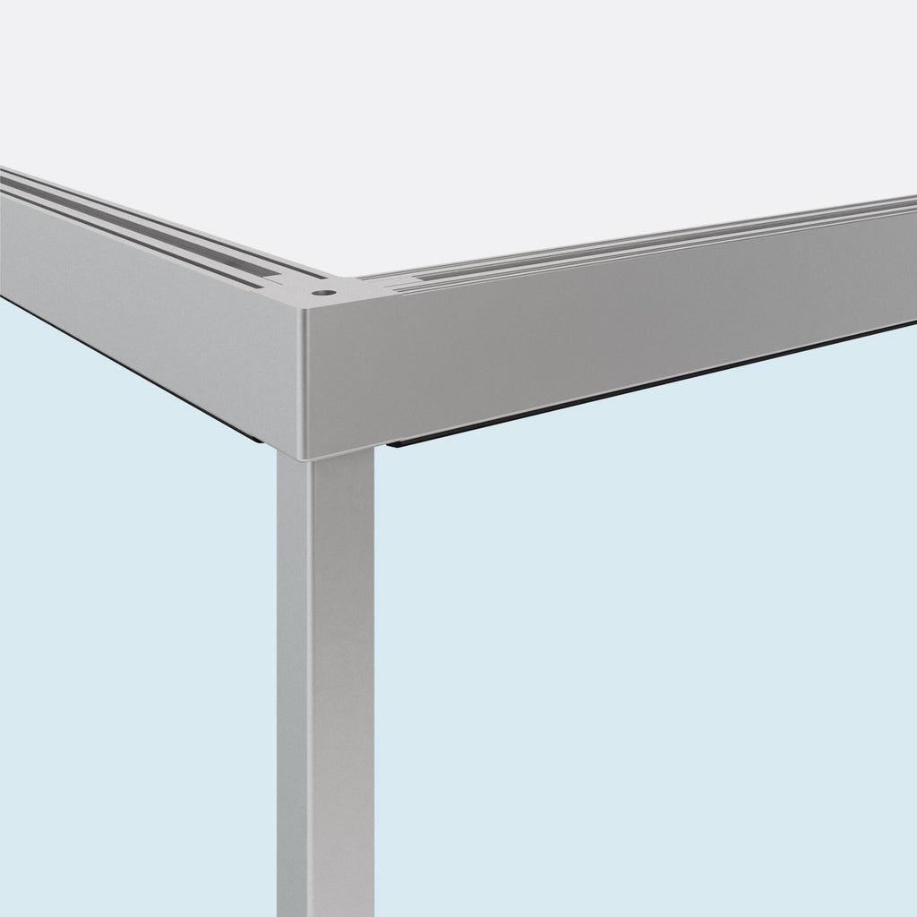 Corner detail of Vetro Fisso aluminum profile system supporting fixed glass panel wall.