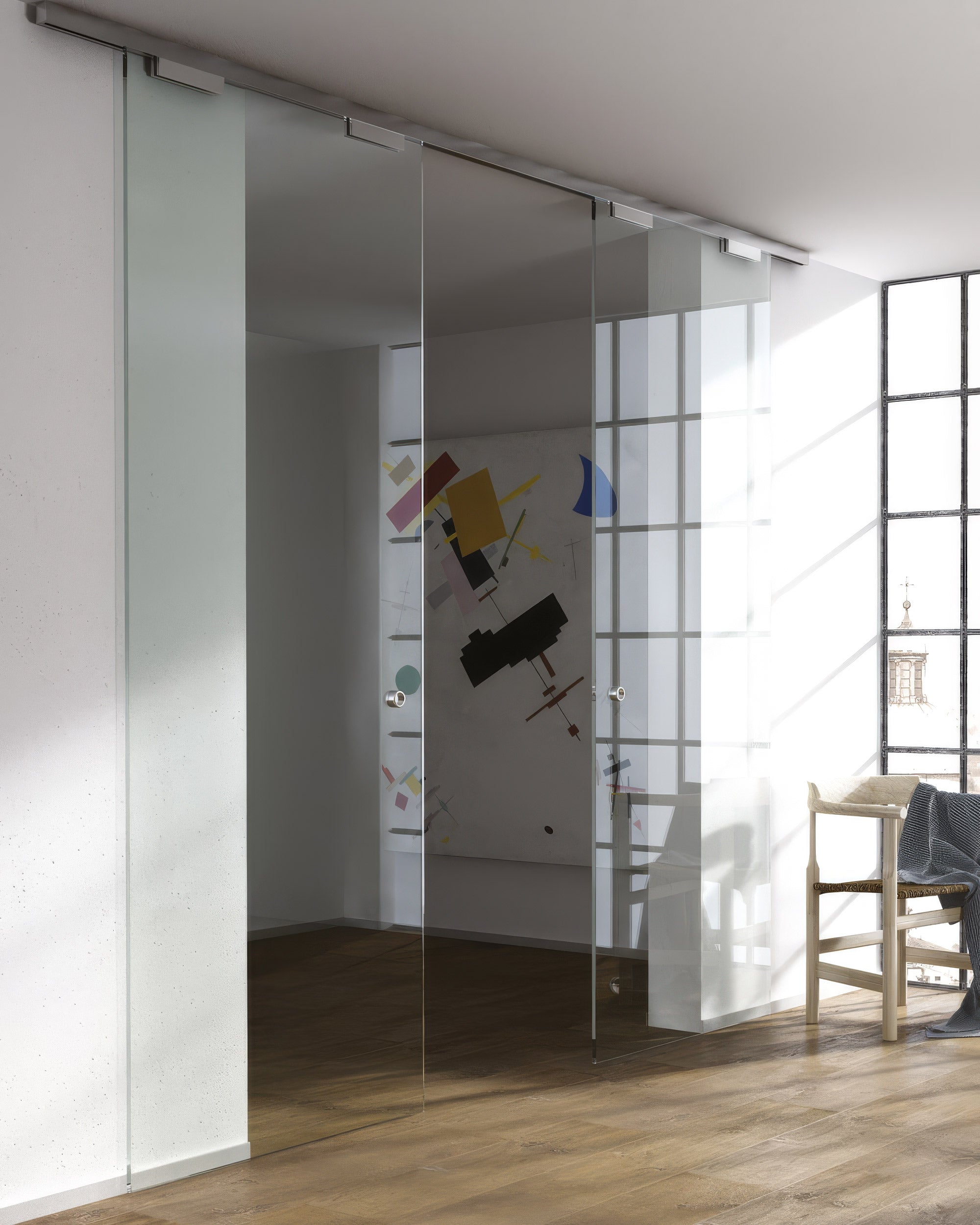 Modern interior with glass sliding doors and a well-lit room.