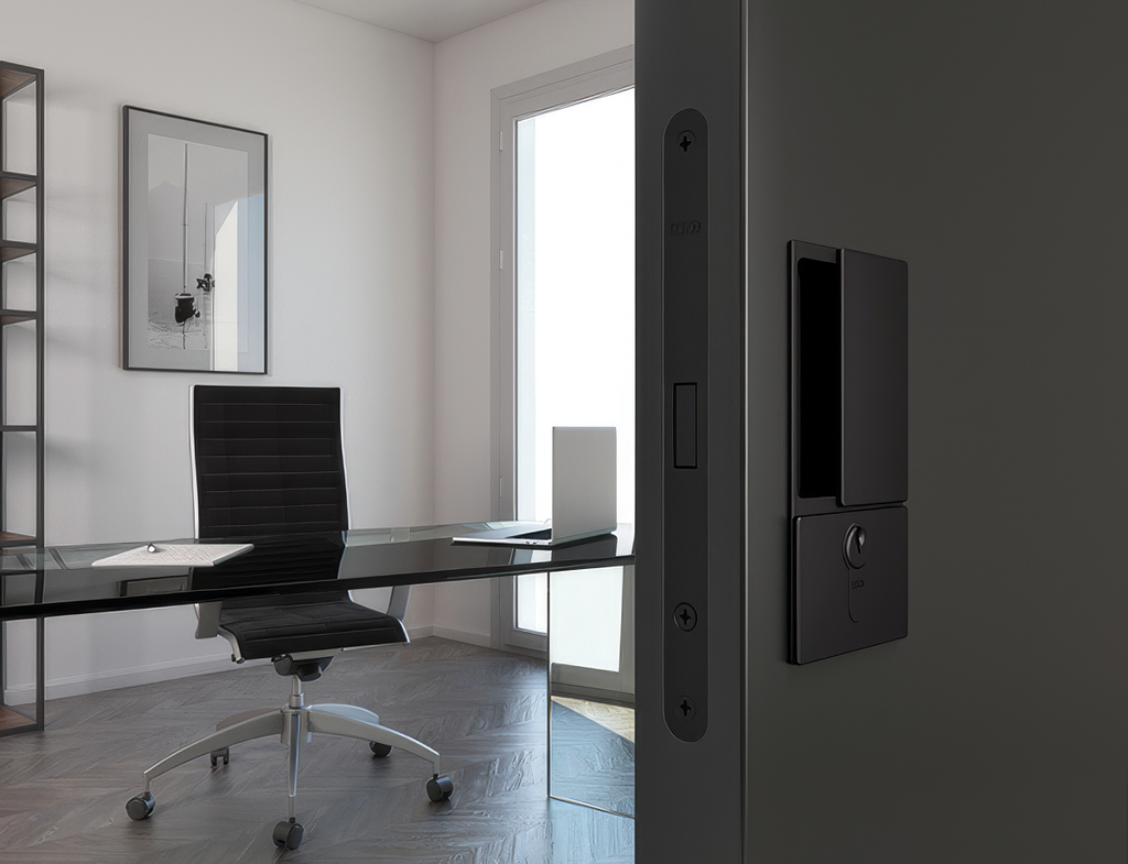 Modern office with a desk, chair, and wall-mounted device.