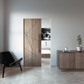 Modern interior with a wooden sliding door, black chair, and sideboard.